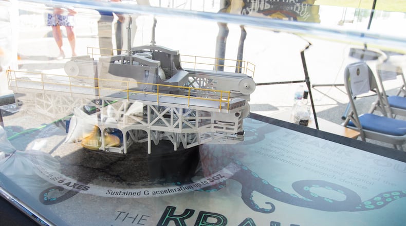 A model of the disorientation research device nicknamed “The Kraken” is displayed at the dedication ceremony for the Captain Ashton Graybiel Acceleration Research Facility at Naval Medical Research Unit Dayton, June 17, 2016 on Wright-Patterson Air Force Base, Ohio. The Kraken, named for a mythical sea monster and which is housed at the facility, allows researchers to create the most realistic motion simulations ever seen, using all six degrees of freedom and up to three G's of force. (U.S. Air Force photo by R.J. Oriez/Released)