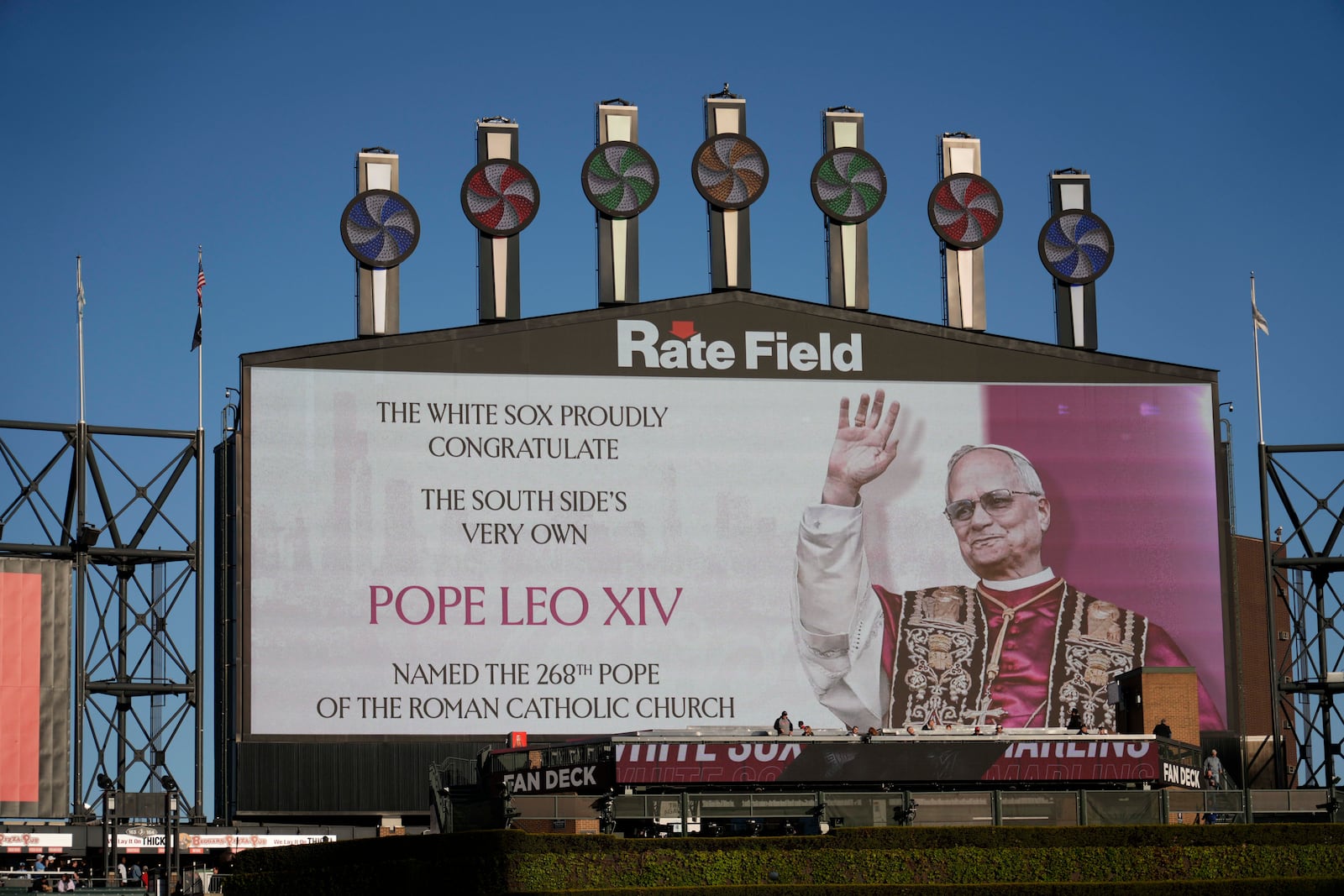 The Chicago White Sox honors Pope Leo XIV on the scoreboard before a baseball game against the Miami Marlins, Friday, May 8, 2025, in Chicago. (AP Photo/David Banks)