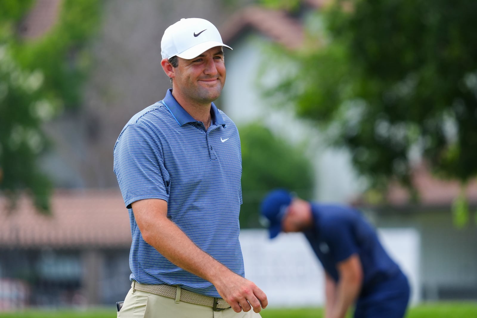 Scottie Scheffler reacts on the 14th hole during the first round of the Charles Schwab Challenge golf tournament at Colonial Country Club in Fort Worth, Texas, Thursday, May 22, 2025. (AP Photo/LM Otero)
