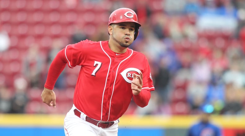 The Reds' Eugenio Suarez runs to third base during a game against the Cubs on Monday, April 2, 2018, at Great American Ball Park in Cincinnati.