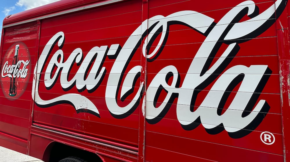 FILE - The Coca-Cola logo adorns the side of a delivery truck, May 15, 2024, in southeast Denver. (AP Photo/David Zalubowski, File)