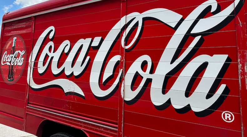 FILE - The Coca-Cola logo adorns the side of a delivery truck, May 15, 2024, in southeast Denver. (AP Photo/David Zalubowski, File)
