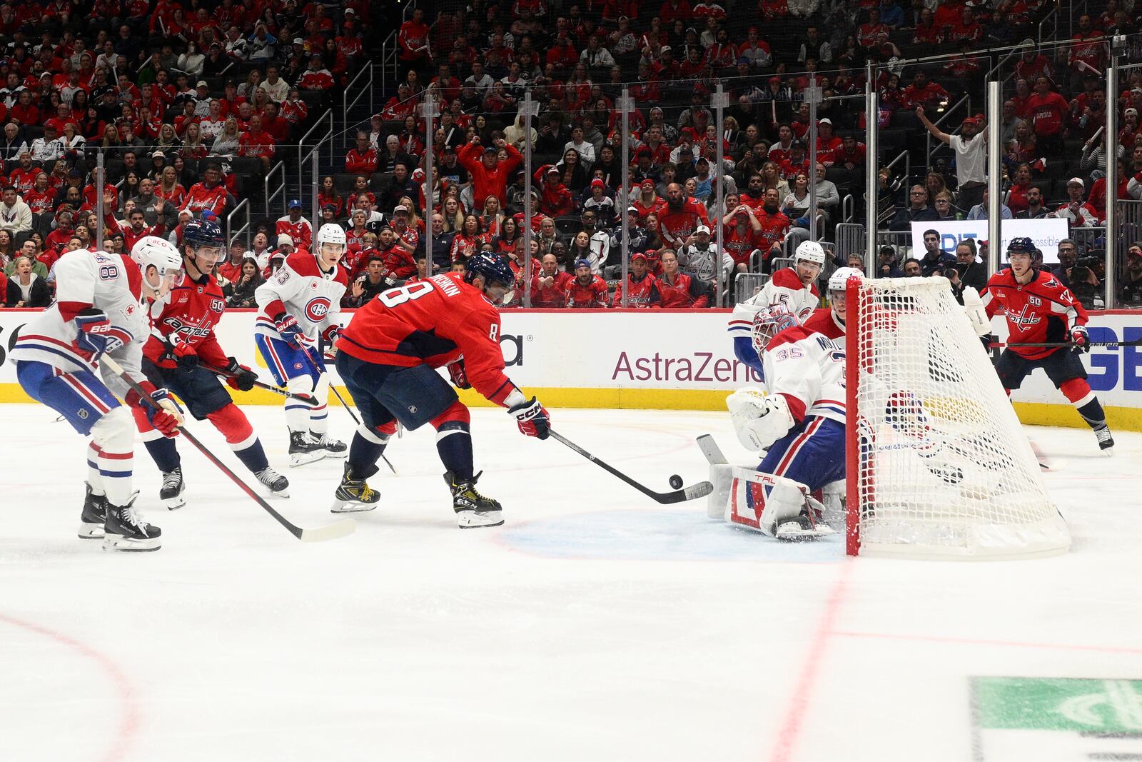 Washington Capitals left wing Alex Ovechkin (8) shoots the winning goal against Montreal Canadiens goaltender Sam Montembeault (35) in the overtime of Game 1 of a first-round NHL hockey playoff series Monday, April 21, 2025, in Washington. (AP Photo/Nick Wass)