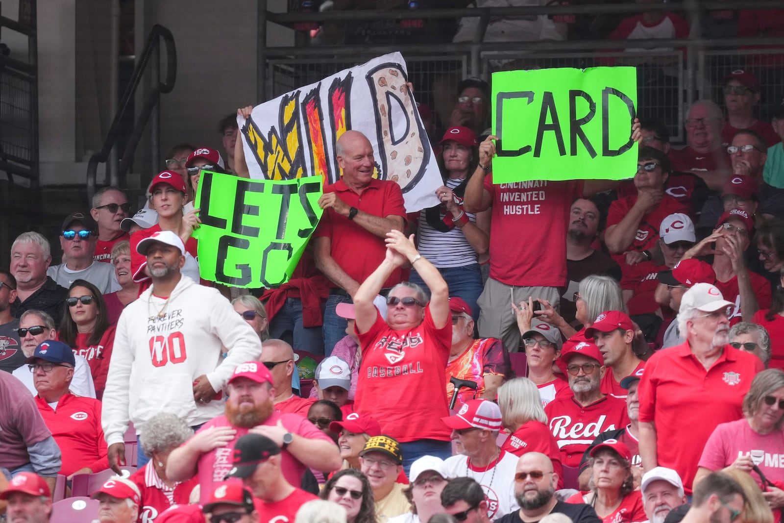 Cincinnati Reds fans cheer during the fourth inning of a baseball game against the Pittsburgh Pirates, Thursday, Sept. 25, 2025, in Cincinnati. (AP Photo/Jeff Dean)