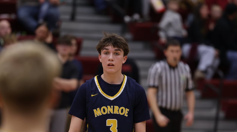 Monroe’s Garrett Mattingly (3) looks down the court during his game against Ross on Friday night at Ross High School. ELIJAH COOK / CONTRIBUTED