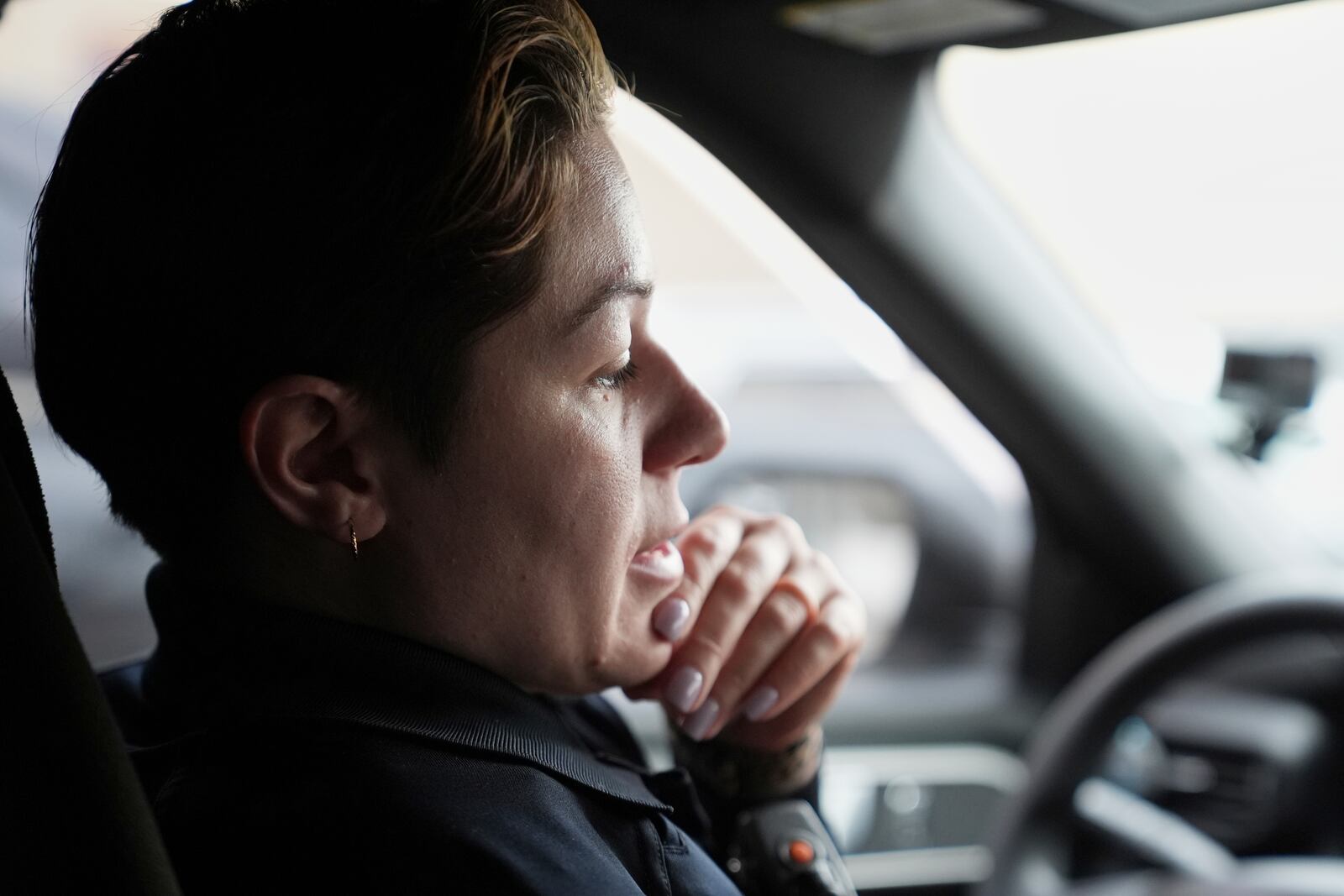 Crisis Intervention Response Team (CIRT) members Philadelphia Police Officer Vanity Cordero checks a computer for calls to assist on, in Philadelphia, Friday, March 14, 2025. (AP Photo/Matt Rourke)