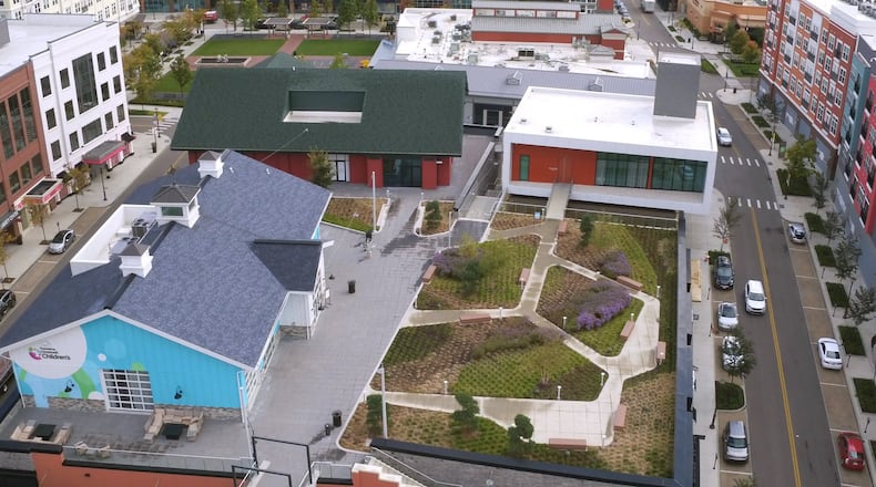 This rooftop garden at Liberty Center has a spiral walkway, Sabin Hall, TriHealth Triumph gardens and Unity Chapel and Kona Grill near The Square. TY GREENLEES / STAFF