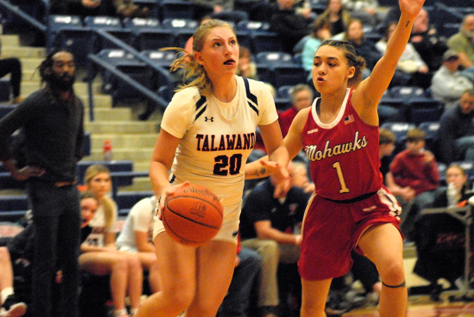 Talawanda's Sadie Van Gordon (20) drives past Madison's Malerie Bobbit (1) on Monday night in Oxford. Chris Vogt/CONTRIBUTED