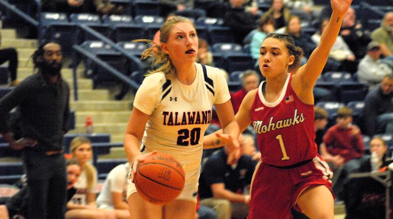 Talawanda's Sadie Van Gordon (20) drives past Madison's Malerie Bobbit (1) during a game last season. Chris Vogt/CONTRIBUTED