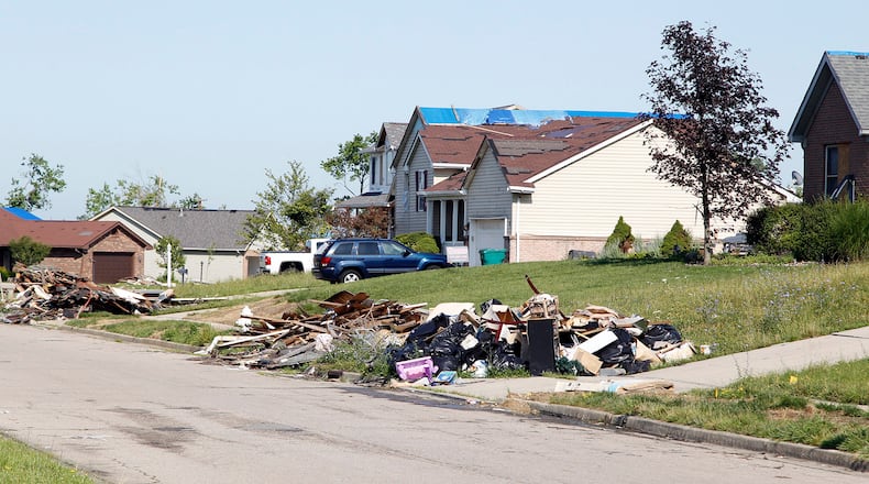 Damaged home debris along Butterfield Drive in Beavercreek nearly two months after the Memorial Day tornadoes ripped through the area in 2019. TY GREENLEES / STAFF