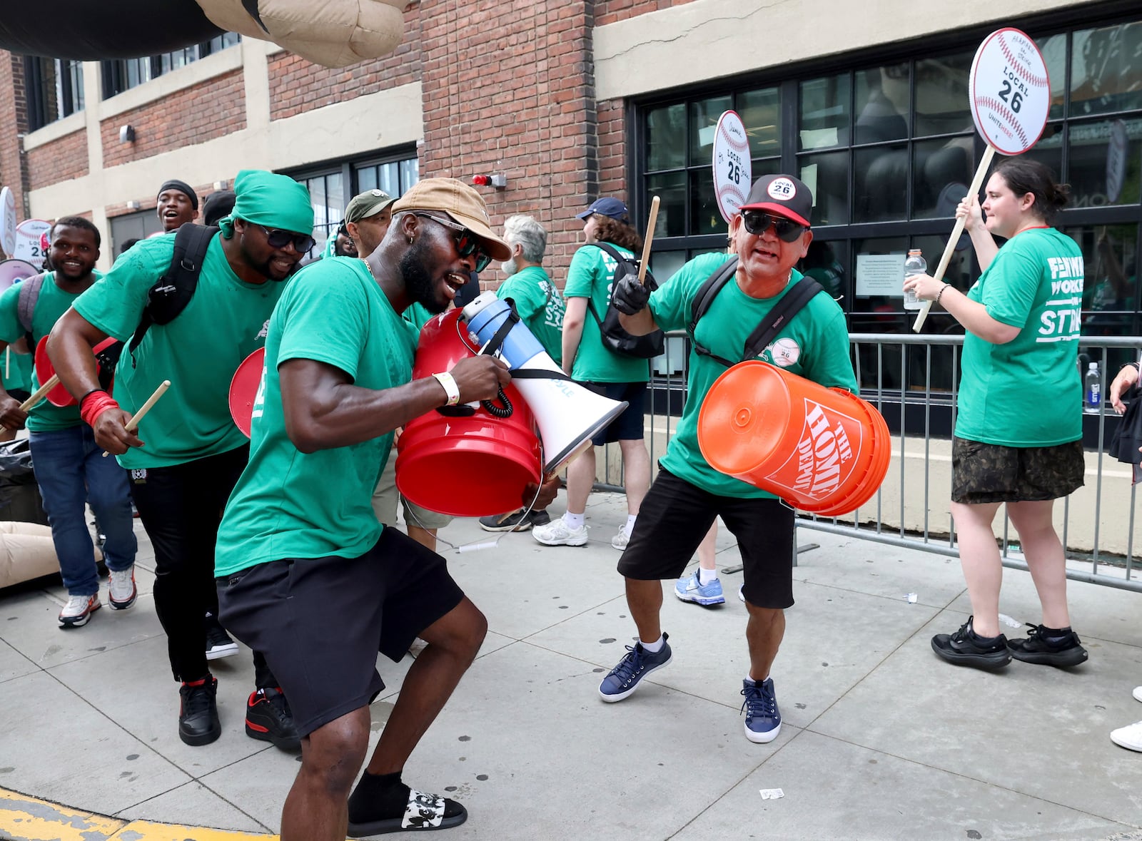 Concession workers from Fenway Park picket outside the ballpark Friday, July 25, 2025, in Boston before a baseball game between the Boston Red Sox and the Los Angeles Dodgers. (AP Photo/Mark Stockwell)