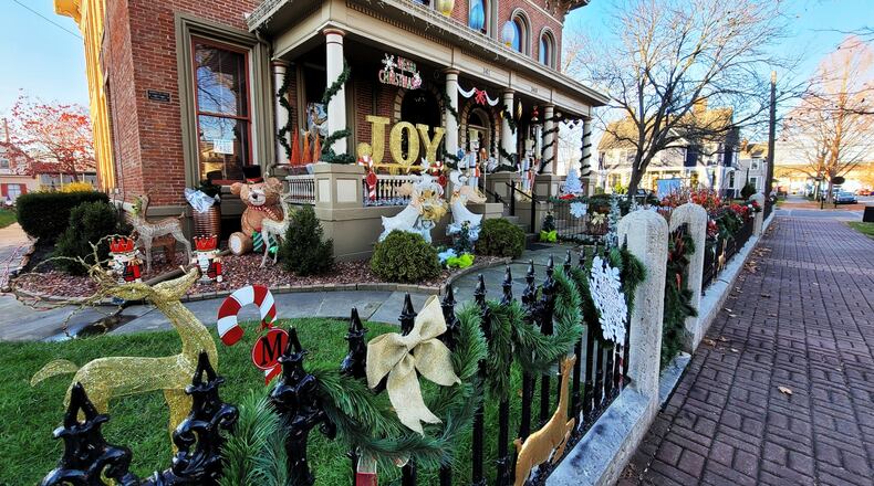 Many homes in German Village are decorated for Saturday's Light Up German Village, which will operate from 6-9 p.m. NICK GRAHAM / STAFF