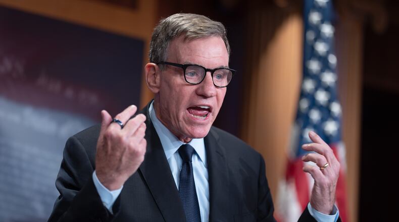 FILE - Sen. Mark Warner, D-Va., the top Democrat on the Senate Intelligence Committee, speaks about the Trump administration following reports that only Republican lawmakers received security briefings on the Trump-ordered military strikes against boats in the Caribbean, during a news conference at the Capitol in Washington, Thursday, Oct. 30, 2025. (AP Photo/J. Scott Applewhite, File)