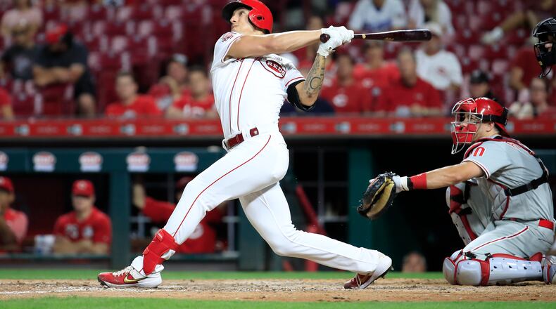 CINCINNATI, OHIO - SEPTEMBER 04:  Michael Lorenzen #21 of the Cincinnati Reds hits a two run home run in the 8th inning against the Philadelphia Phillies at Great American Ball Park on September 04, 2019 in Cincinnati, Ohio. (Photo by Andy Lyons/Getty Images)
