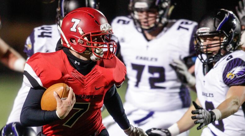 Madison’s Mason Whiteman carries the ball during last Friday night’s 35-27 win over Cincinnati Hills Christian Academy in a Division V, Region 20 semifinal at Lakota East. NICK GRAHAM/STAFF