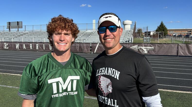 Lebanon senior quarterback Luke Faler (left) with his father, Lebanon football coach Micah Faler. MIKE DYER/WCPO