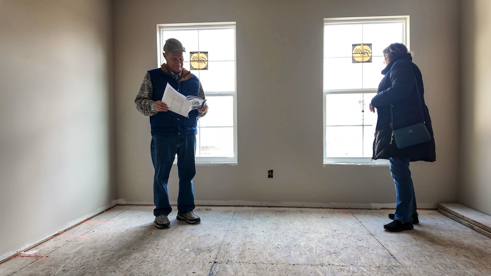 Hamilton School board member Joe Copas and wife, Joni Copas, tour as construction continues on the first two “Build Back the Block” homes on East Ave. in Hamilton. These are part of a major housing and neighborhood reinvestment initiative in Hamilton, first announced by City Manager Craig Bucheit in late 2024. NICK GRAHAM/STAFF
