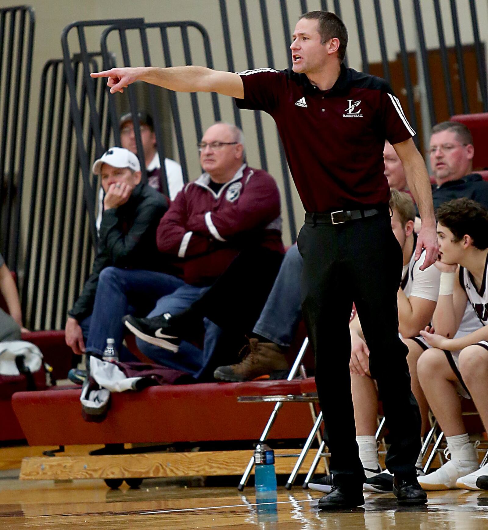 Lebanon coach Kevin Higgins signals to his team during Saturday night’s game against visiting Fenwick. CONTRIBUTED PHOTO BY E.L. HUBBARD