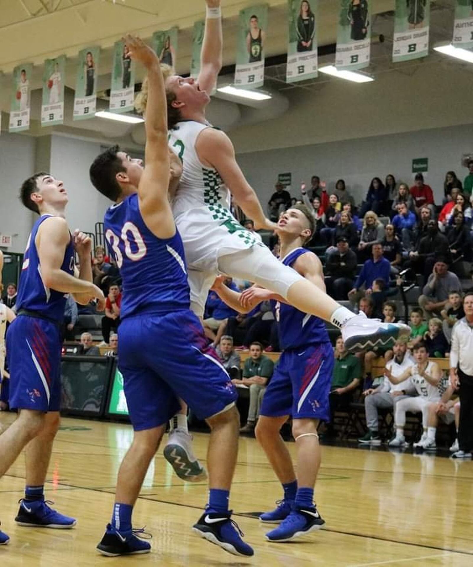 Badin’s Justin Pappas (13) puts up a shot over Carroll’s Gavin Kinney (30) during Friday night’s game at Mulcahey Gym in Hamilton. Badin won 43-42. CONTRIBUTED PHOTO BY TERRI ADAMS