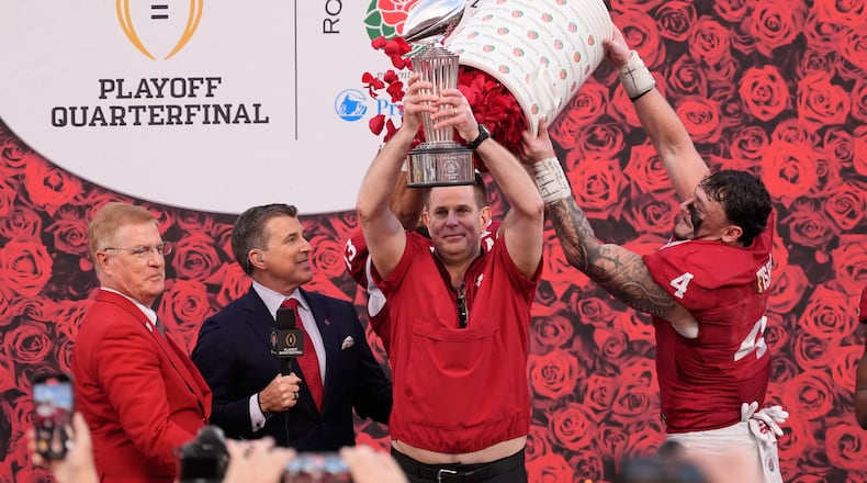 Indiana head coach Curt Cignetti holds the winner's trophy after a win over Alabama in the Rose Bowl College Football Playoff quarterfinal game Thursday, Jan. 1, 2026, in Pasadena, Calif. (AP Photo/Mark J. Terrill)