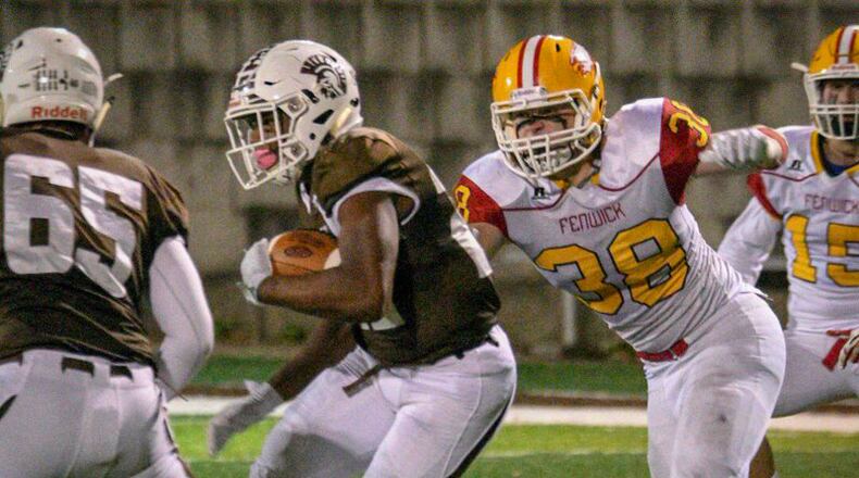 Fenwick’s John Stevenson (38) comes after Roger Bacon’s Corey Kiner (22) during Friday night’s game at Bron Bacevich Memorial Stadium in St. Bernard. Fenwick won 37-7. CONTRIBUTED PHOTO BY ROB MCCULLEY/RAM PHOTOGRAPHY