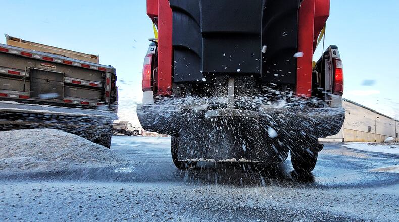 Fairfield Public Works department crews clean snow plows and return salt 5o the barn after a night of treating roads Wednesday, Dec. 8, 2021 in Fairfield. NICK GRAHAM / STAFF