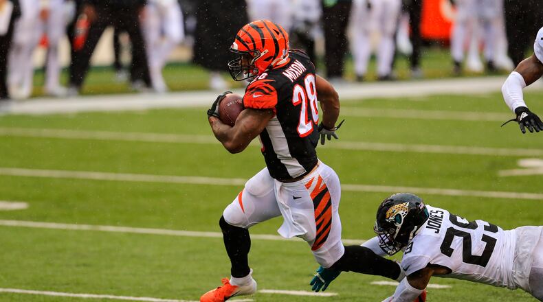 Cincinnati Bengals running back Joe Mixon (28) runs for a touchdown in front of Jacksonville Jaguars strong safety Josh Jones (29) in the second half of an NFL football game in Cincinnati, Sunday, Oct. 4, 2020. (AP Photo/Aaron Doster)