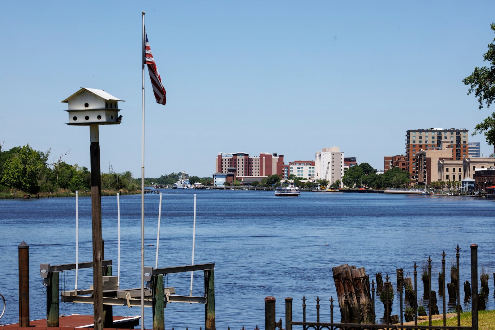 The Cape Fear River, which supplies water to much of New Hanover County, flows past downtown Wilmington, N.C., Monday, April 28, 2025. (AP Photo/Ben McKeown)