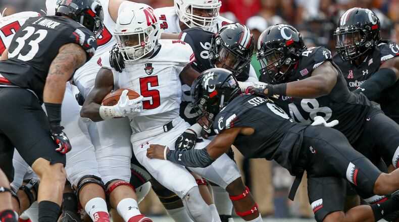 Kentel Williams #5 of the Austin Peay Governors runs the ball as Linden Stephens #9 of the Cincinnati Bearcats makes the stop at Nippert Stadium on August 31, 2017 in Cincinnati, Ohio. (Photo by Michael Hickey/Getty Images)