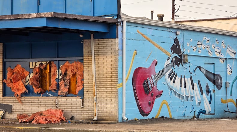 Fire consumed Middletown store Lester's Rock N Roll Shop on Tuesday, Jan. 20, 2026. It was boarded up the next morning. NICK GRAHAM/STAFF