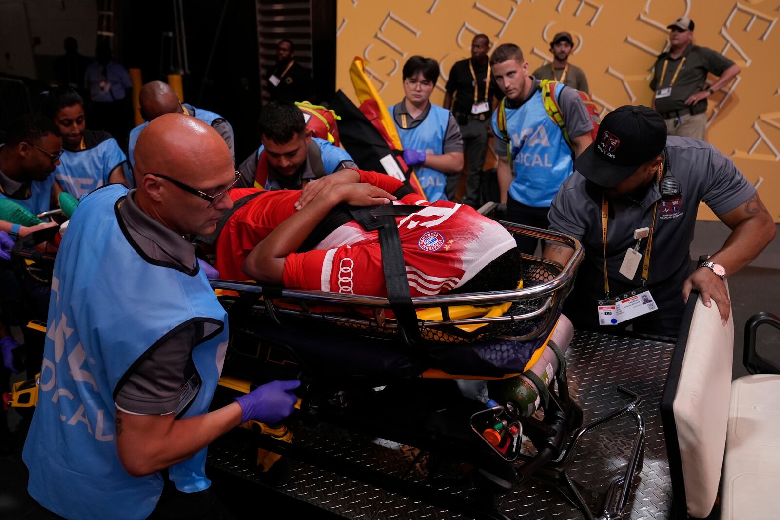 Bayern Munich's Jamal Musiala is taken off the field after an injury during the Club World Cup quarterfinal soccer match between PSG and Bayern Munich in Atlanta, Saturday, July 5, 2025. (AP Photo/Brynn Anderson)