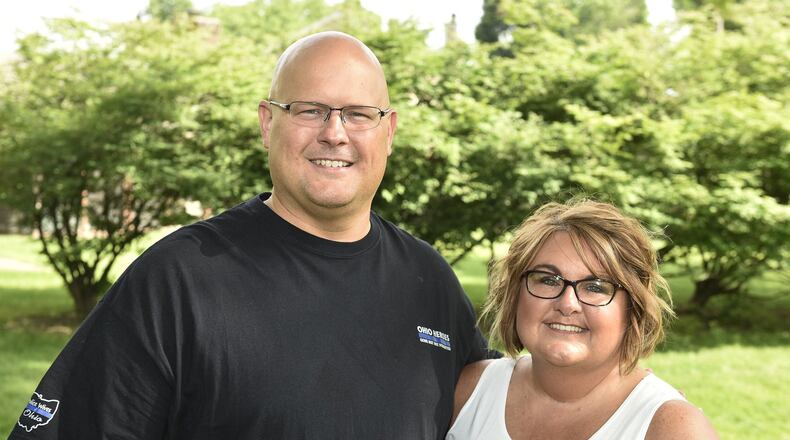Retired Monroe Police Sgt. Eric Walton, pictured with his wife, Cathy, recently retired from the Monroe Police department. Along with his grandfather, father and uncle they have over 100 years of law enforcement service in Butler County. NICK GRAHAM/STAFF