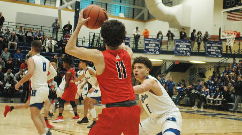 Hamilton’s Braedyn Jackson defends Fairfield’s Caleb Cropenbaker during Tuesday night’s game at the Hamilton Athletic Center. Host Hamilton won 70-57. RICK CASSANO/STAFF