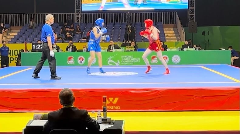 A Hamilton girl is battling her way to international recognition as rising star in the rough and tumble world of kick boxing. The Badin High School junior (in red) just returned from the 8th Wushu Junior World Championships in Jakarta, Indonesia. Shea Scarborough also fought in the Pam Am Games in Brazil last summer and the 17-year is racking up an impressive fight resume as well as a growing list of international travels. (Contributed Photo\Journal-News)