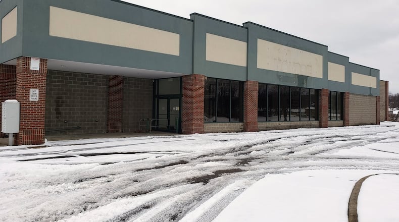 Monroe council approved legislation Tuesday for design services and a purchase agreement for the former IGA store and strip center that will be converted into a new police facility. NICK GRAHAM/STAFF