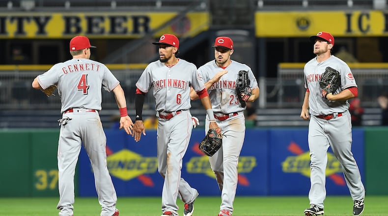 PITTSBURGH, PA - APRIL 11: Members of the Cincinnati Reds celebrate after the final out in their 6-2 win over the Pittsburgh Pirates at PNC Park on April 11, 2017 in Pittsburgh, Pennsylvania. (Photo by Justin Berl/Getty Images)