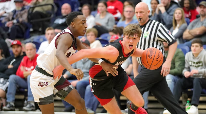 Preble Shawnee's Mason Shrout drives past a Harvest Prep defender during the Division III regional final game Saturday, March 11, 2023 at Trent Arena in Kettering. Preble Shawnee lost to Canal Winchester Harvest Prep 56-49. CONTRIBUTED PHOTO BY MICHAEL COOPER