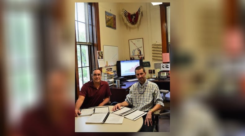 George Ironstrack (right), of Miami University’s Myaamia Center, is shown with Daryl Baldwin of the Miami Tribe of Oklahoma, in the center’s office in Bonham House on the campus. CONTRIBUTED/BOB RATTERMAN
