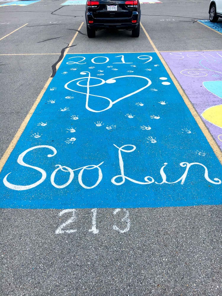 PHOTOS Lakota East seniors paint parking spots