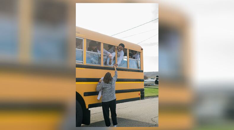 Fairfield High School boys’ basketball has been rolling on a recent winning streak and their team bus recently stopped by a beloved but ill team volunteer’s home to make sure she knew she’s part of the ride. The Fairfield team’s bus stopped by former Fairfield Schools’ employee - and for decades a sports volunteer - Sharon Revel’s home on their way to play in Dayton last weekend. (Provided Photo\Journal-News)
