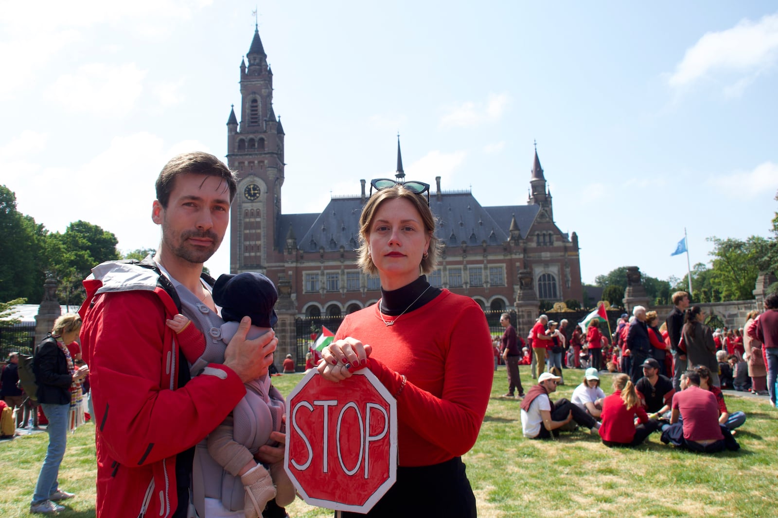 Roos Lingbeek, right, husband Stijn Joosten and daughter Dido stand in front of the Peace Palace during the Red Line protest in The Hague, Netherlands on Sunday, May 18, 2025. (Niels van der Pas via AP)