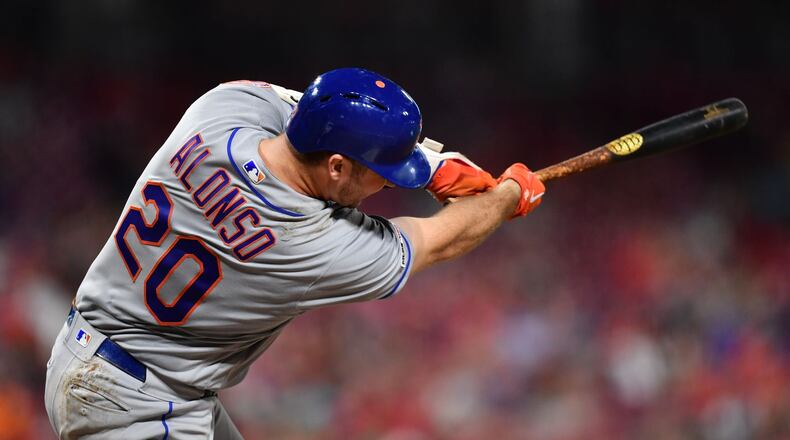 CINCINNATI, OH - SEPTEMBER 20: Pete Alonso #20 of the New York Mets hits his 50th home run of the season, a two-run shot in the eighth inning against the Cincinnati Reds at Great American Ball Park on September 20, 2019 in Cincinnati, Ohio. New York defeated Cincinnati 8-1. (Photo by Jamie Sabau/Getty Images)