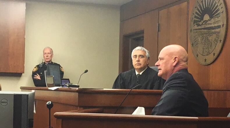 Miami Twp. Detective Todd Comer testifies Monday in a hearing to determine if a 17-year-old accused of shooting to death DoubleTree employee Jayren Graham should be tried as an adult. NICK BLIZZARD/STAFF