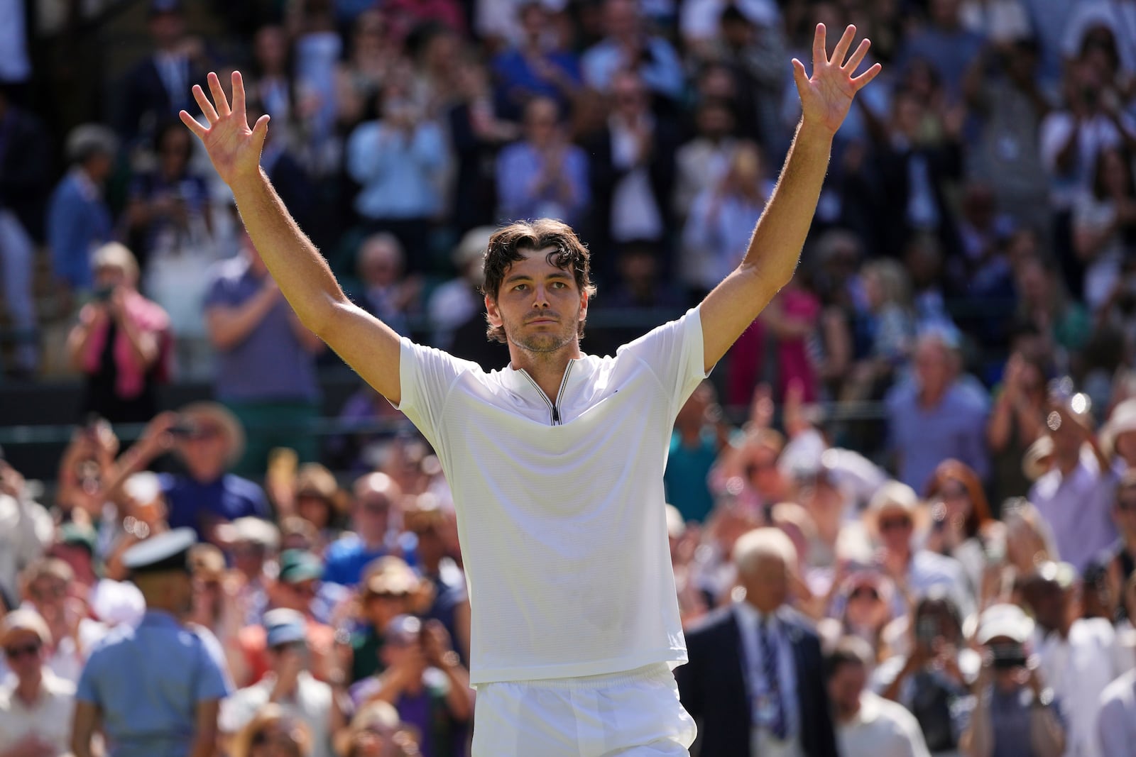 Taylor Fritz of the U.S. celebrates winning the men's singles quarter final match against Karen Khachanov of Russia at the Wimbledon Tennis Championships in London, Tuesday, July 8, 2025.(AP Photo/Kin Cheung)