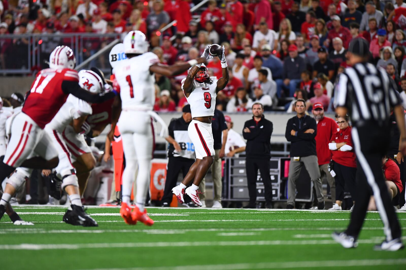 Miami running back Kenny Tracy catches a pass against Wisconsin on Thursday night at Camp Randall Stadium. KYLE HENDRIX / CONTRIBUTED