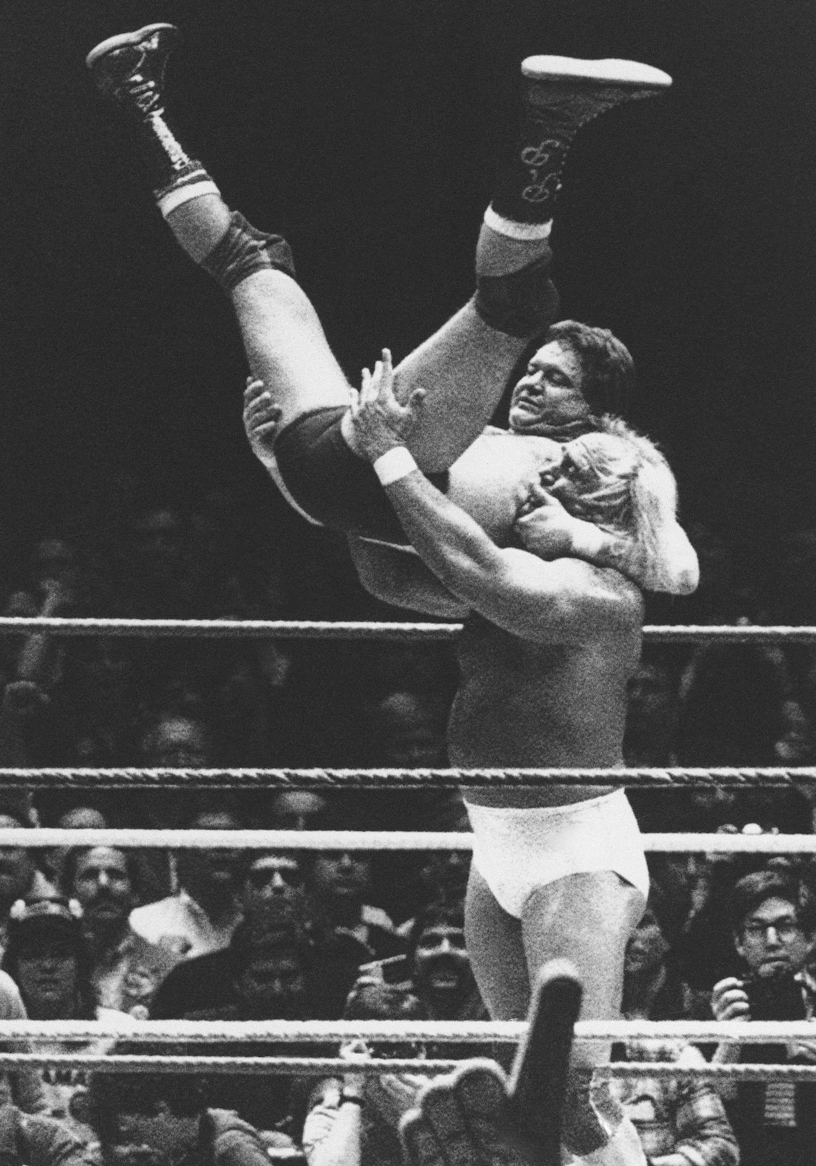 FILE - Wrestler Hulk Hogan prepares to slam "Rowdy" Roddy Piper down on the mat during "WrestleMania," a wrestling extravaganza at New York's Madison Square Garden, March 31, 1985. (AP Photo/Ray Stubblebine, File)