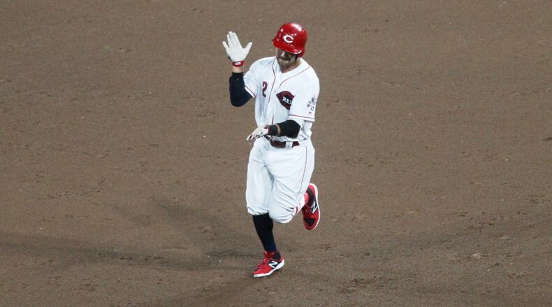 The Reds’ Alex Blandino claps as he runs to second base after a two-run double in the eighth inning against the Chicago White Sox on Monday, July 2, 2018, at Great American Ball Park in Cincinnati. David Jablonski/Staff