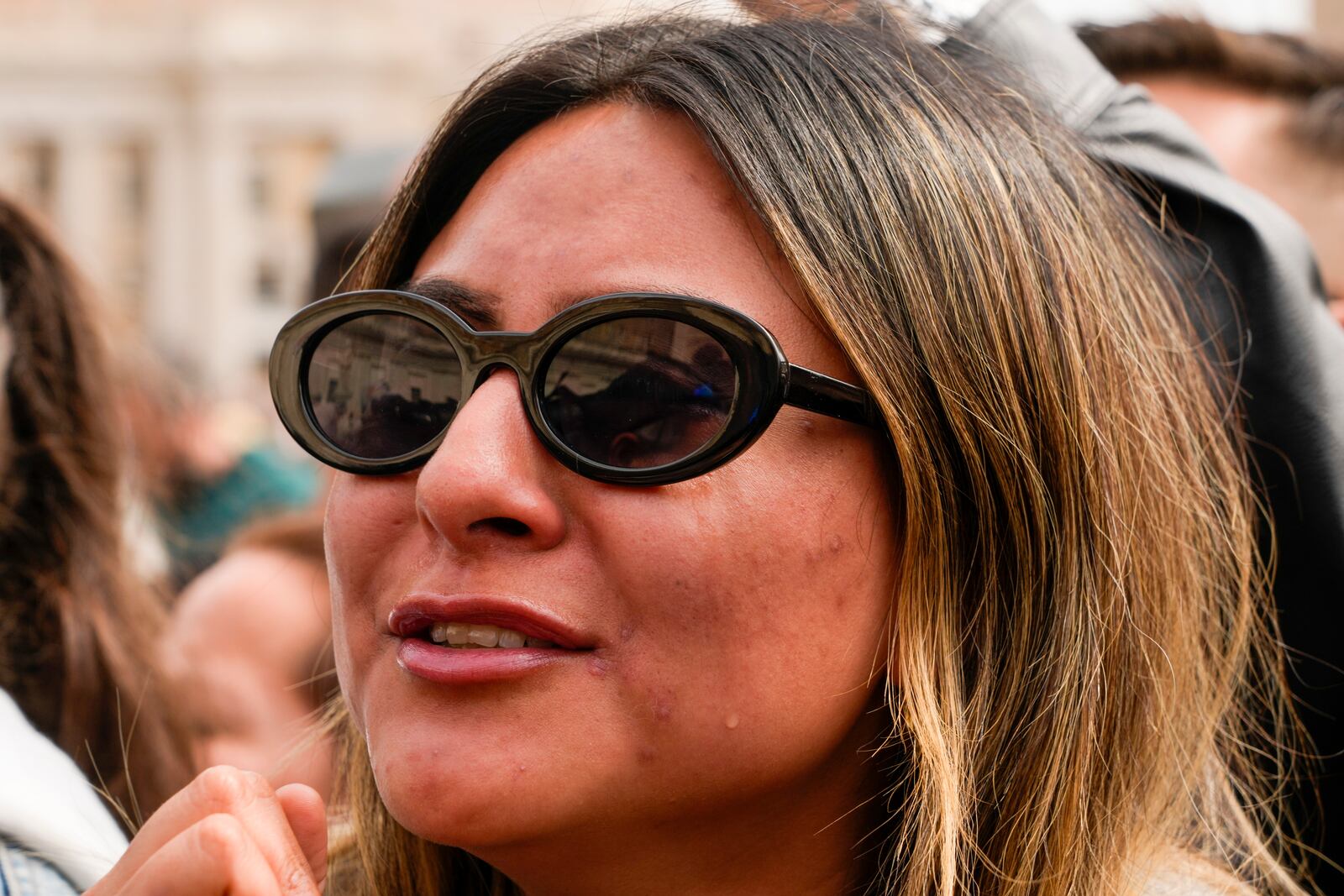 Faithfulget emotional as Pope Francis arrives at the end of the mass on Palm Sunday in St. Peter's Square at The Vatican, Sunday, April 13, 2025. (AP Photo/Gregorio Borgia)