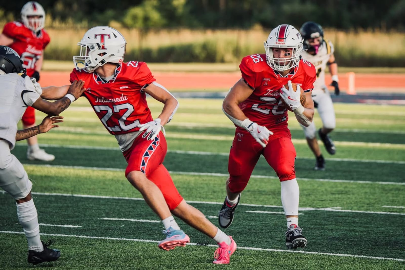 Talawanda running back Lance Cantrell looks for a rushing lane against Taylor on Friday night. JORDAN PHILLIPS / CONTRIBUTED