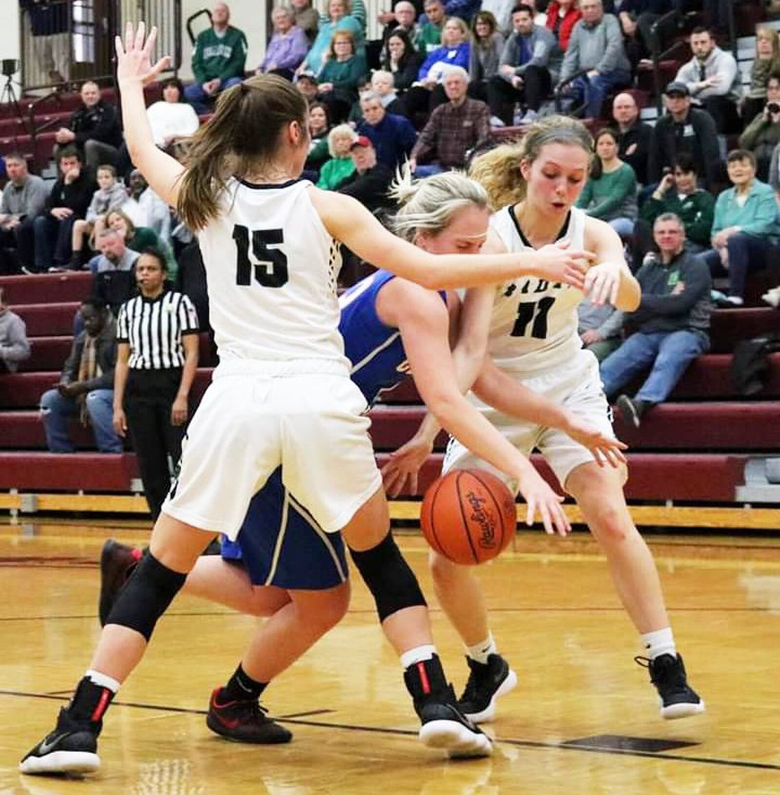 Badin’s Grace Larkin (15) and Emily Maher (11) keep up the defensive pressure against Clinton-Massie on Saturday afternoon at Lebanon. Badin won the Division II sectional opener 54-10. CONTRIBUTED PHOTO BY TERRI ADAMS
